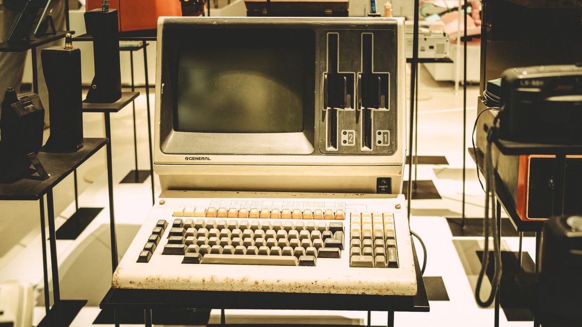 Outdated vintage office computer with floppy drives, standing in for legacy medical practice technology that AI cannot fix