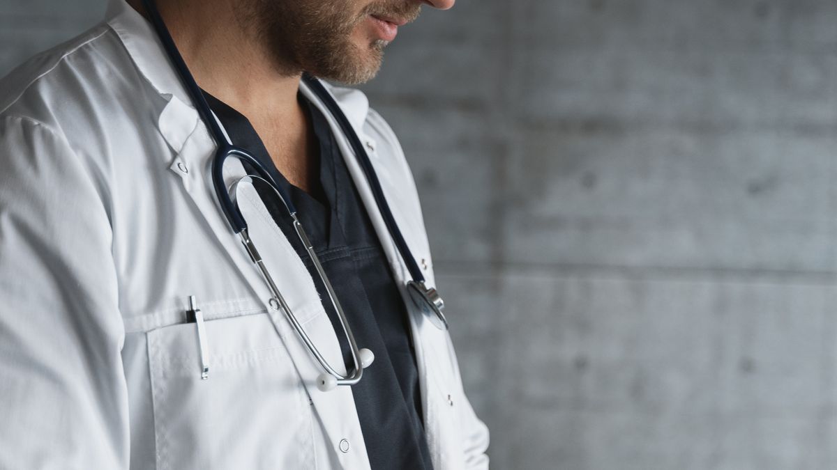 A doctor using a tablet in a medical practice, representing AI adoption in healthcare