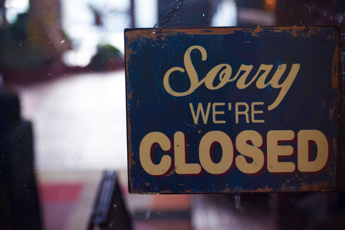 A Sorry We're Closed sign hanging on a glass door, showing how wrong Google hours make patients think a medical practice is closed