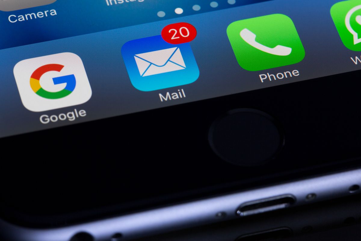 Close up of a smartphone home screen showing the Google, Mail, and Phone apps, the three channels a medical practice uses to ask a patient for a review