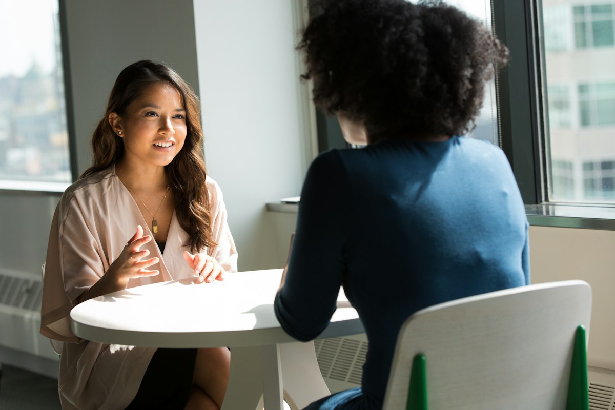 A therapist and a new client talking across a table, representing how a therapy practice fills its caseload after Meta's 2026 mental health ad restrictions