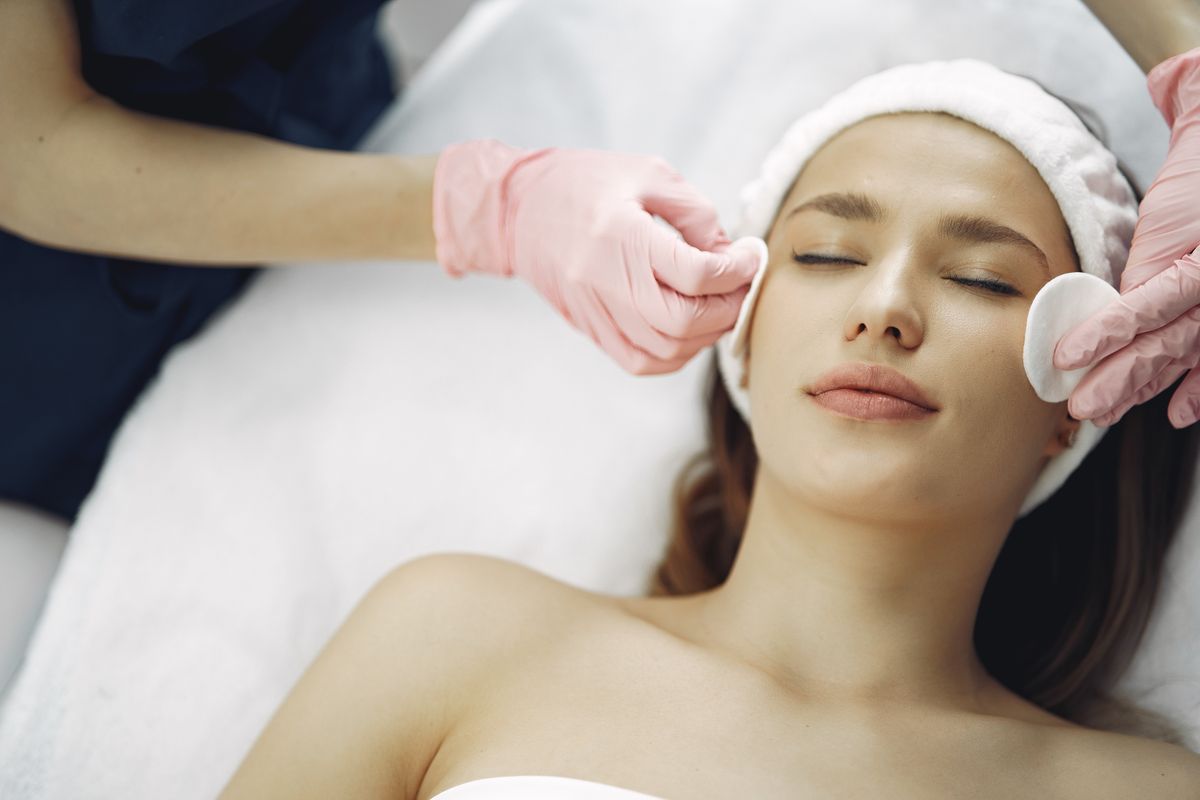 A patient receiving a facial treatment at a med spa, the kind of result that before and after Facebook ads showcase