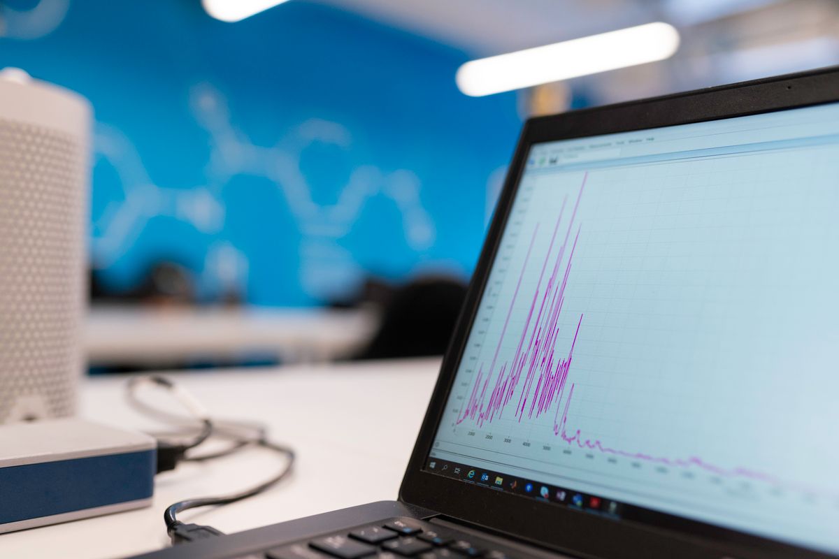 A laptop screen showing analytics graphs, the kind of report a medical practice reviews to spot click fraud and invalid clicks in Google Ads