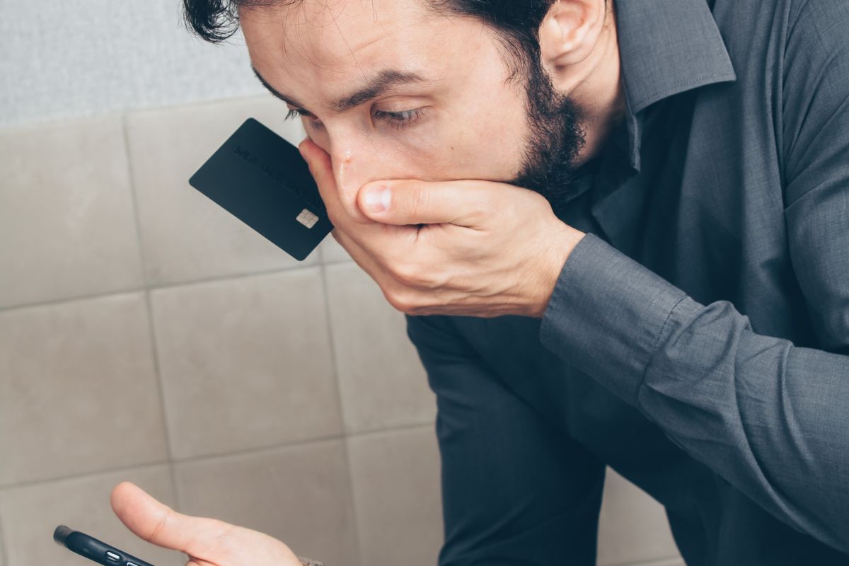 A worried patient looking at a suspicious health ad on a smartphone, the kind of AI deepfake doctor scam now spreading on social media