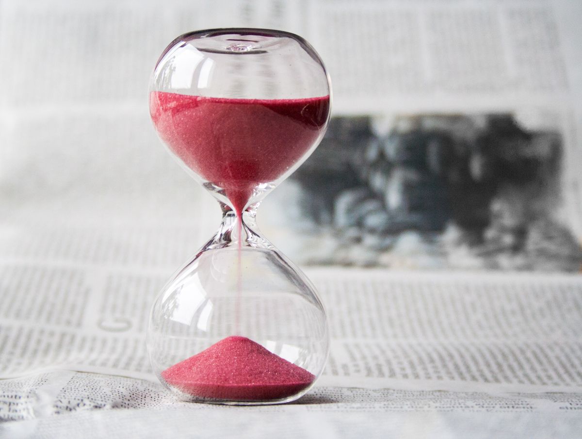 An hourglass with sand running through it, illustrating limited time offers and urgency in medical practice marketing