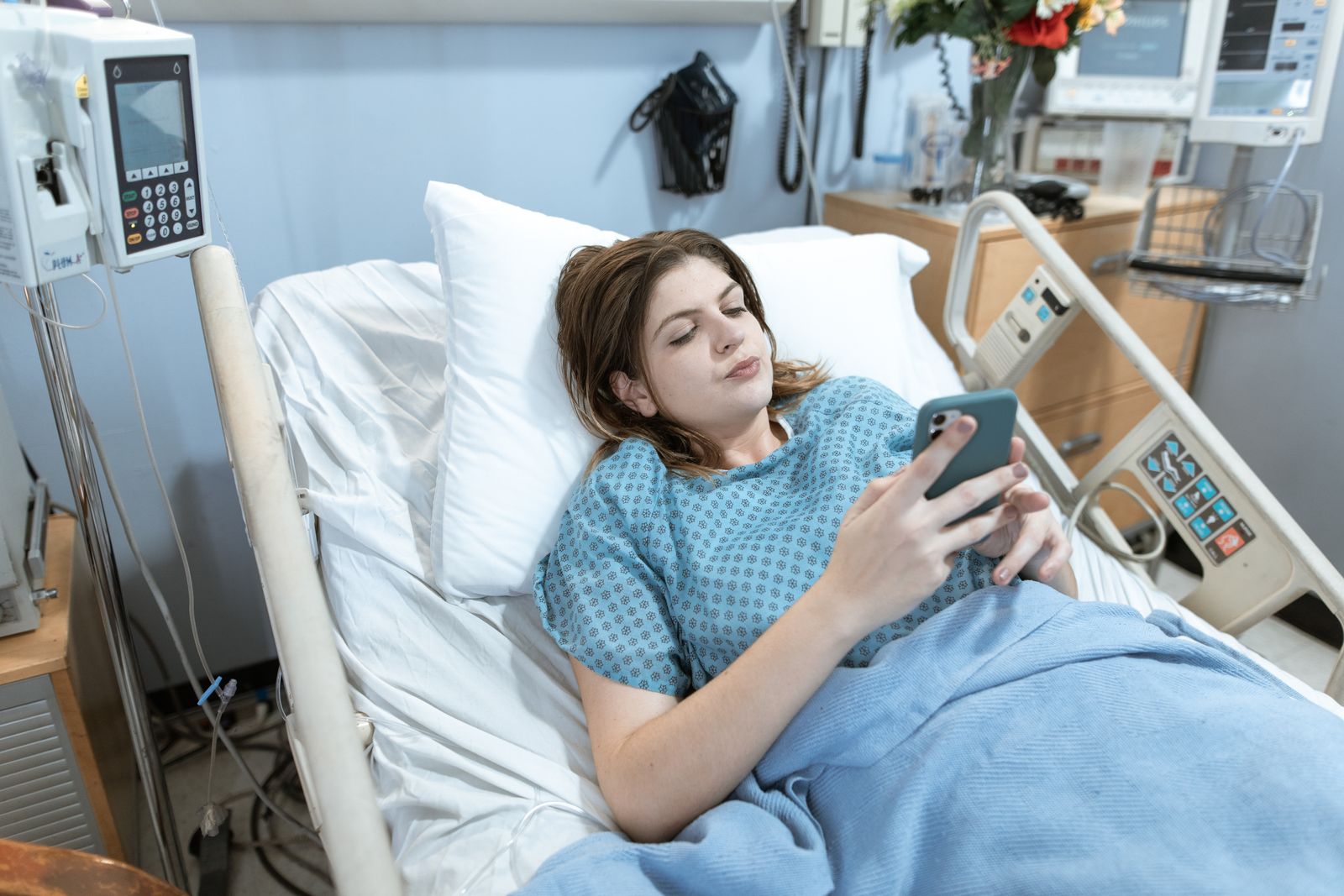 A patient using a smartphone instead of logging into a medical practice patient portal