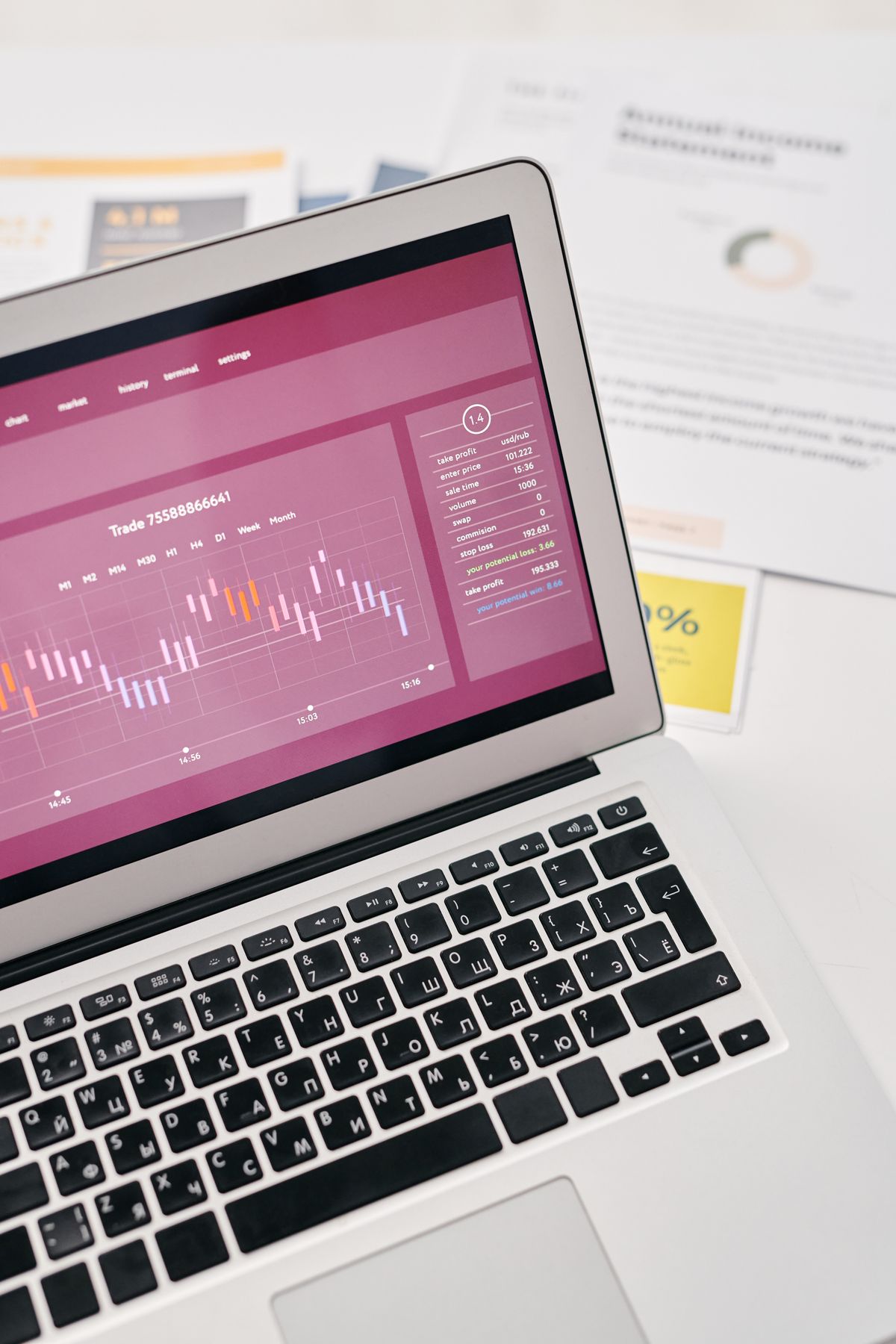 Laptop showing marketing analytics charts and reports on a desk, used to track which channels bring patients