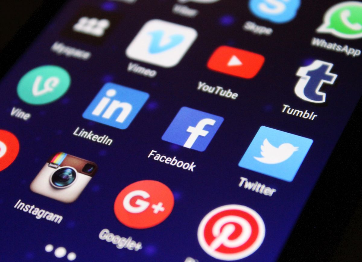 A smartphone home screen crowded with app icons, showing how a new medical practice app would compete for space patients rarely have