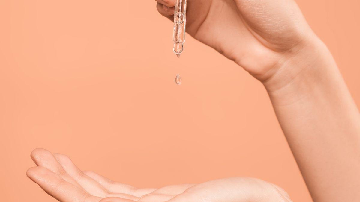 Skincare serum dropping onto an open hand, the kind of aesthetic and wellness content patients search and save on Pinterest before booking a med spa