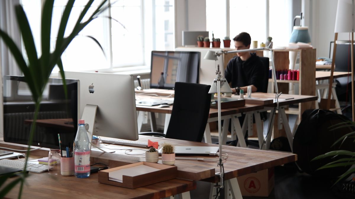 A modern workspace with computers used to build a fast medical practice website that loads quickly for patients