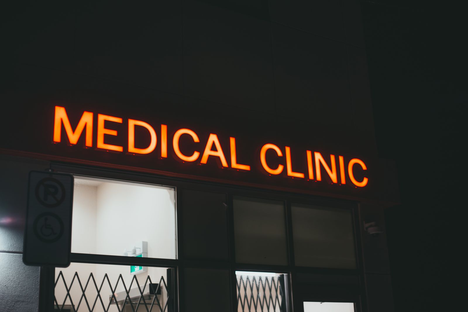 Exterior signage of a medical clinic at night, the kind of clear storefront sign Google wants to see in a Business Profile video verification