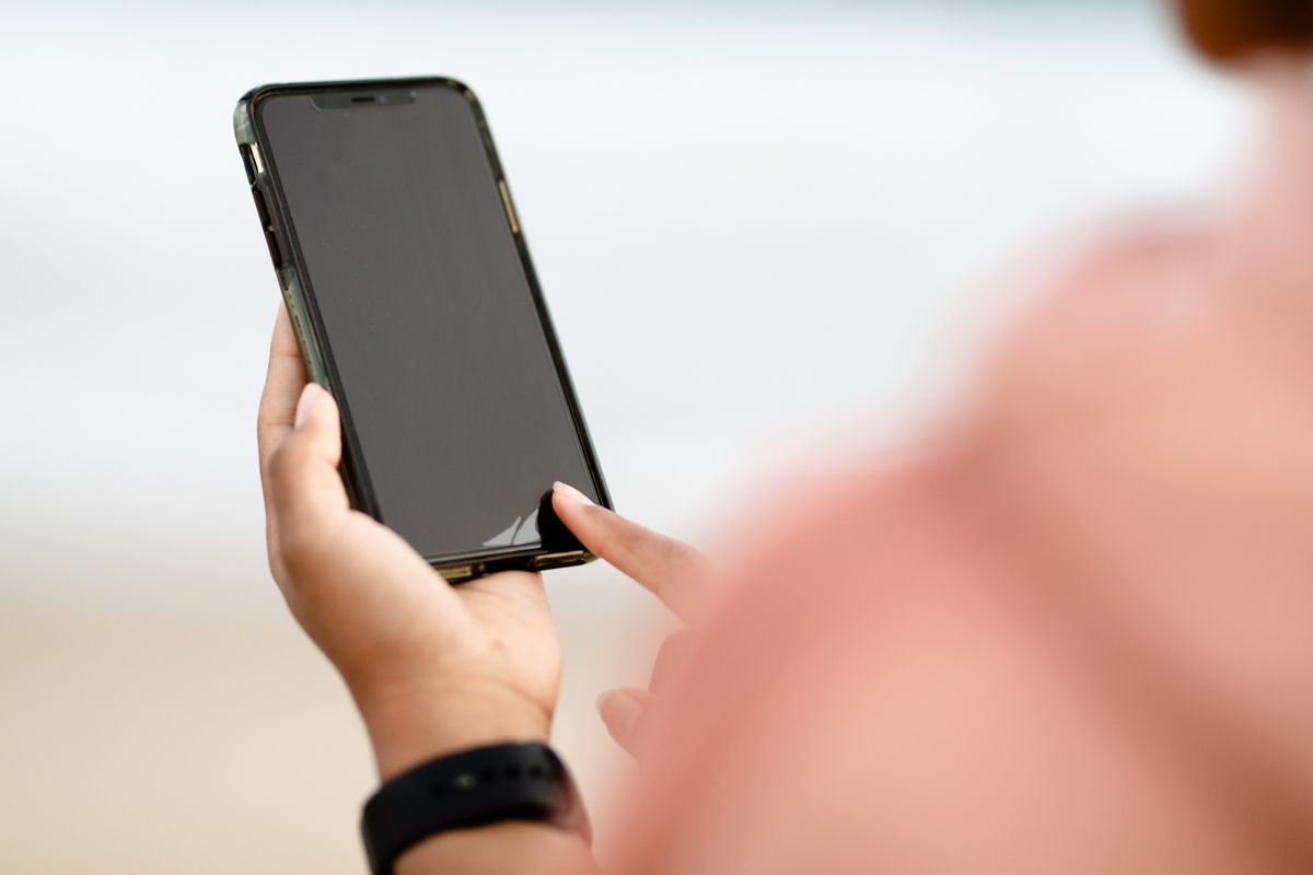 A patient looking up a medical practice on a smartphone, the moment a Google Knowledge Panel builds instant trust