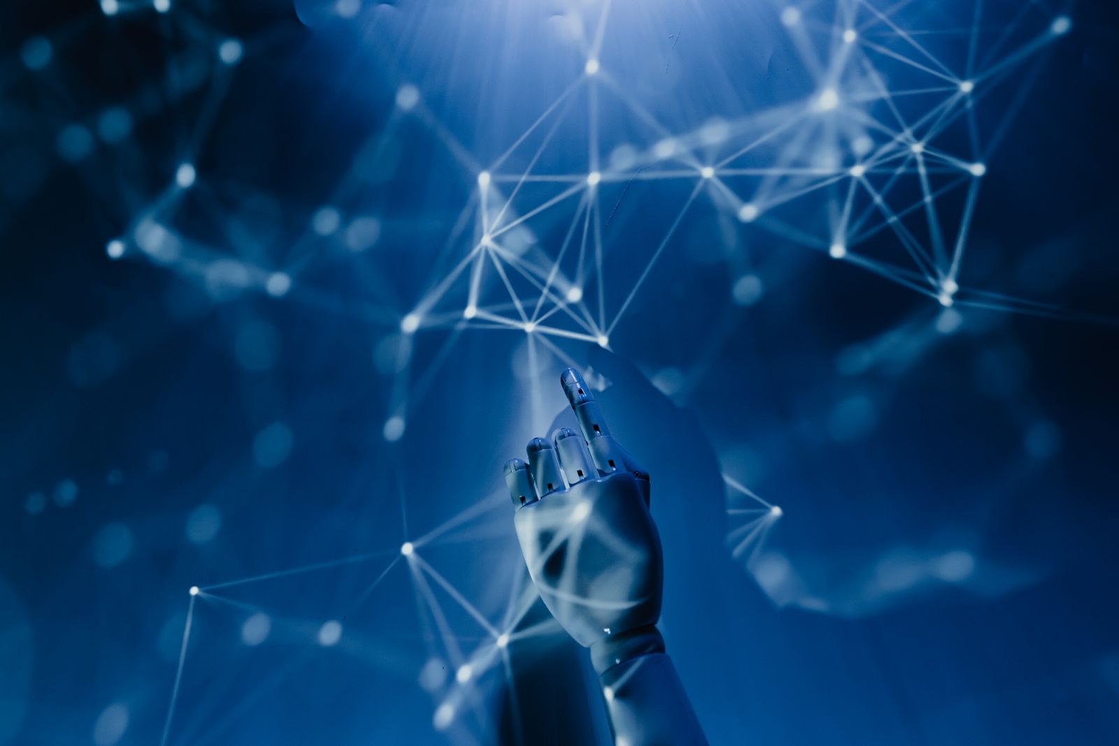 An abstract robotic hand touching a glowing network of data points, representing the healthcare AI race and what it means for independent medical practices