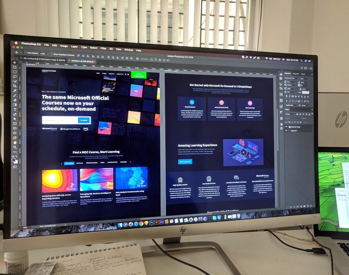 A laptop showing a website design layout, representing the cost of building a medical practice website