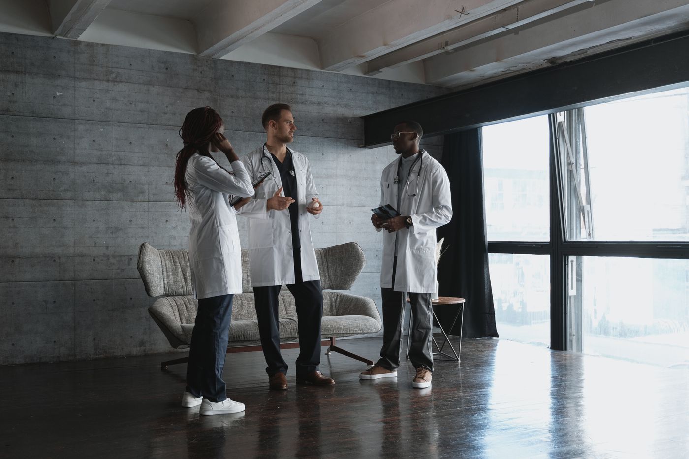Two medical professionals talking together in a clinic, the kind of relationship that drives physician referrals
