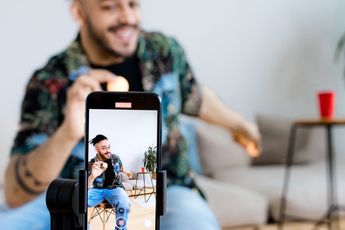 A phone on a small tripod recording a short social media video for a medical practice