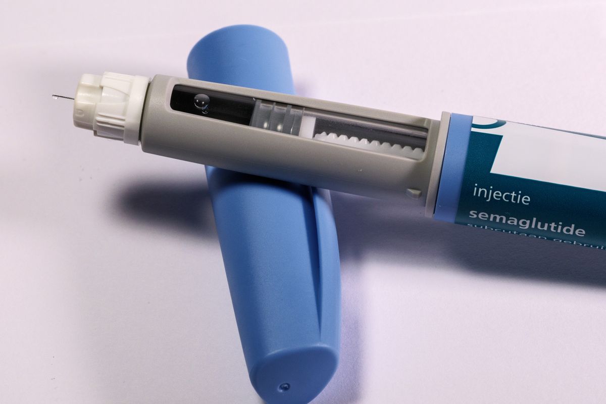 A semaglutide GLP-1 weight loss injection pen on a plain surface