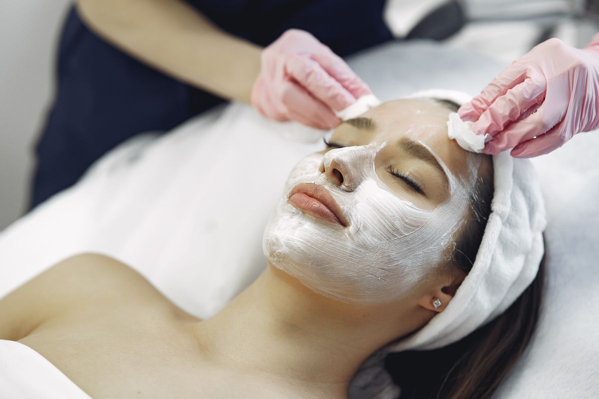 A client receiving a facial treatment at a med spa, the kind of aesthetic service that med spa marketing has to fill the schedule with