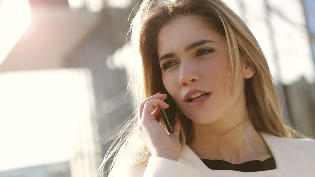 A young Gen Z patient using her phone to search for and choose a medical practice before ever calling the office