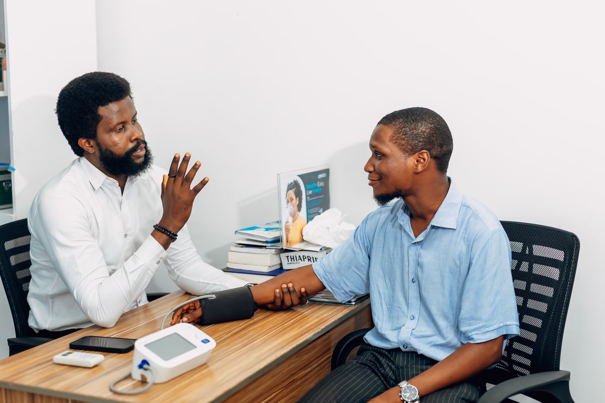 A doctor reviewing results with a male patient during a men's health and low testosterone consultation