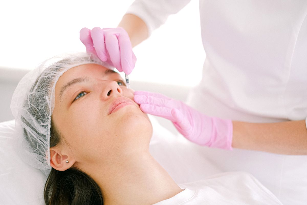 A patient during a cosmetic aesthetic consultation, the kind of trust based moment plastic surgery marketing has to earn before it happens