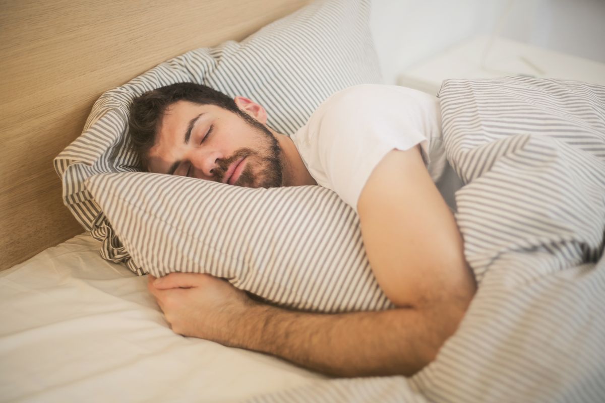A man sleeping peacefully in bed, the result a sleep clinic gives patients who finally get diagnosed and treated