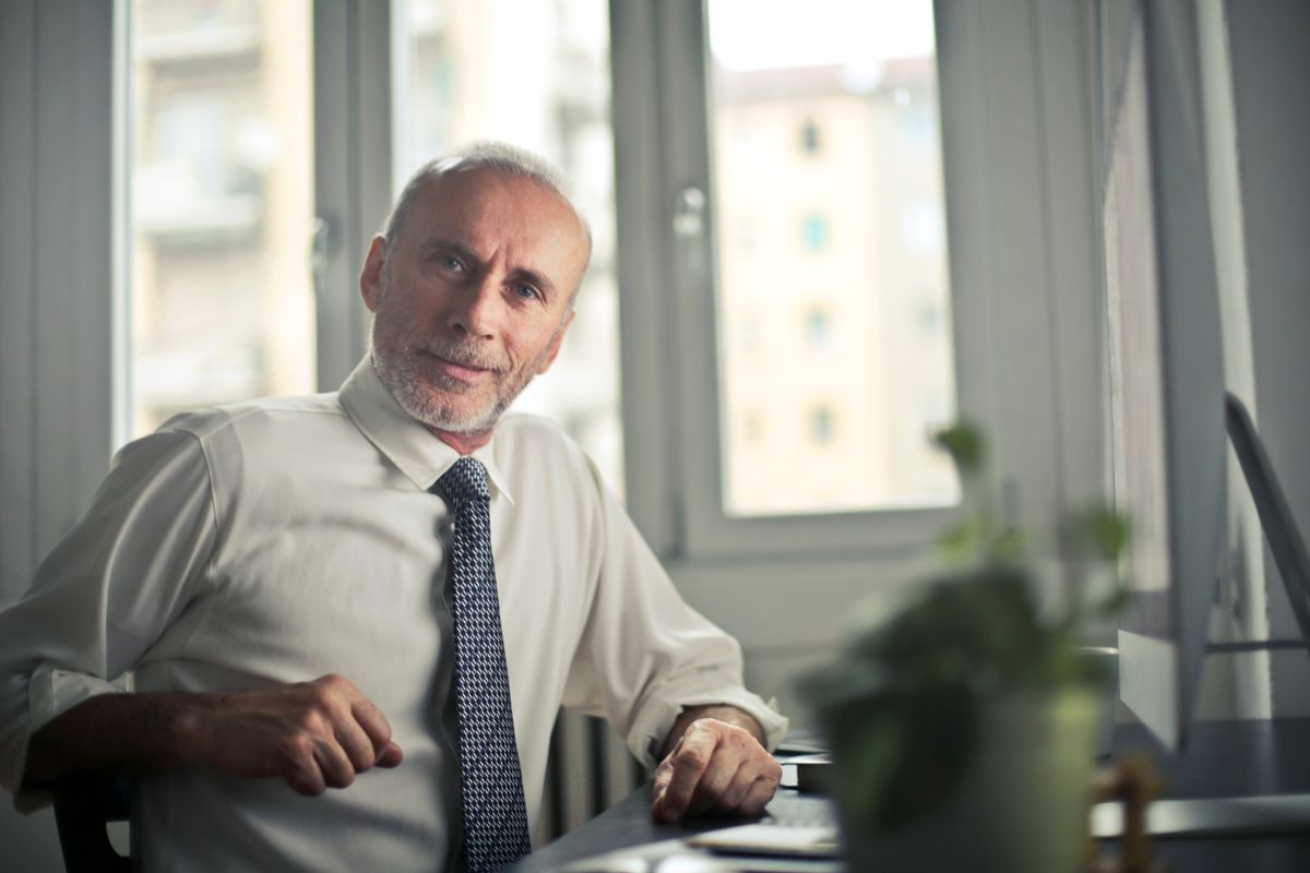 A middle aged man thinking about starting testosterone replacement therapy at a TRT clinic