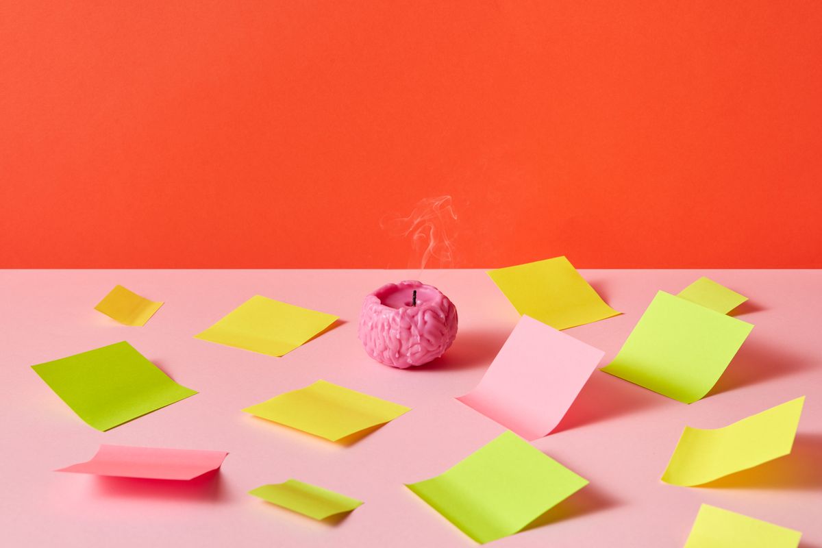 A brain surrounded by colorful notes, representing focus and attention for an ADHD clinic marketing guide