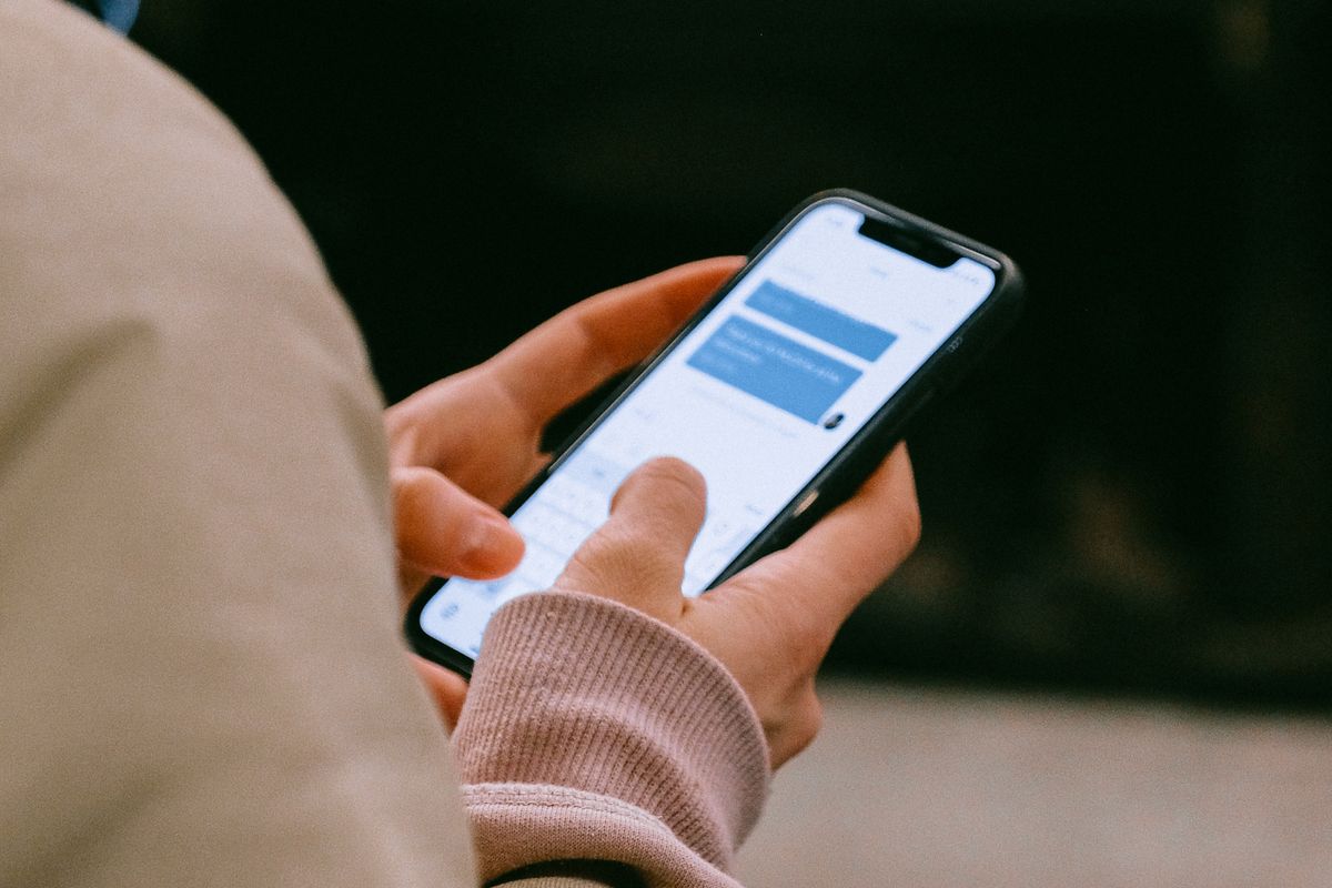A patient checking a medical practice's Google reviews on a smartphone, including a one star review with no comment