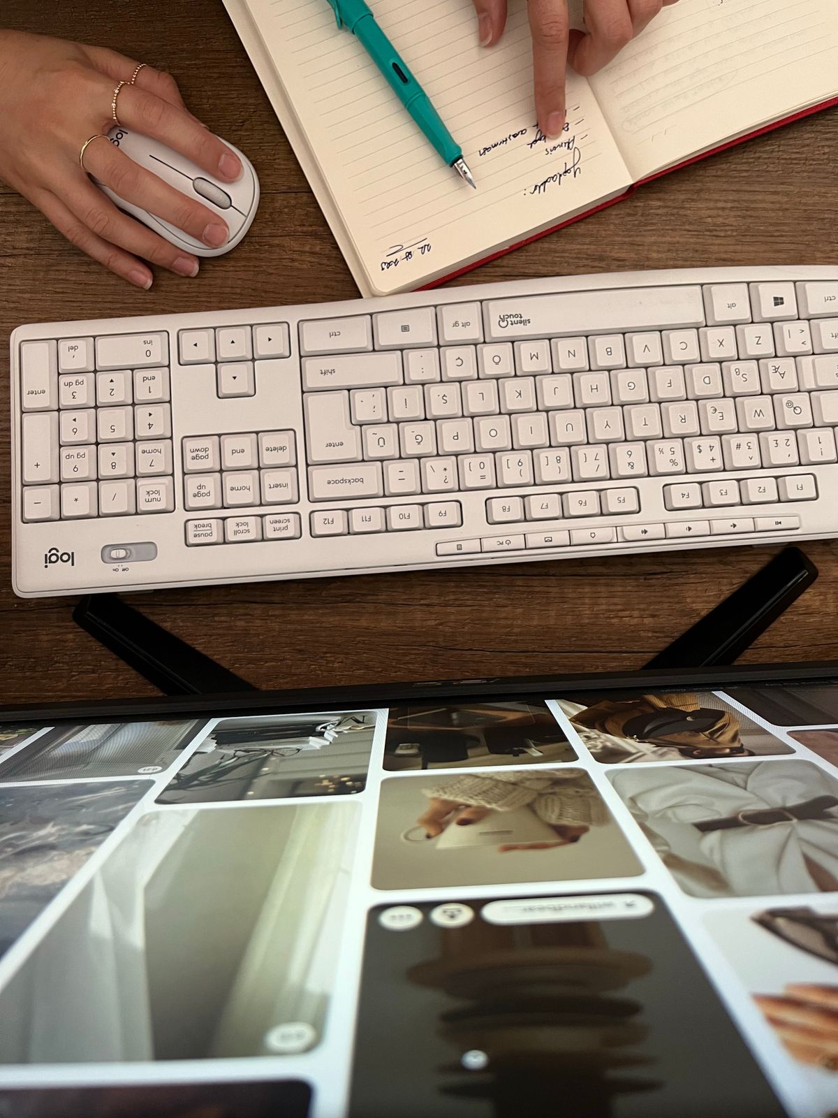 A desk with a keyboard, a planning notebook and a screen showing a grid of content photos, representing repurposing one idea into many posts