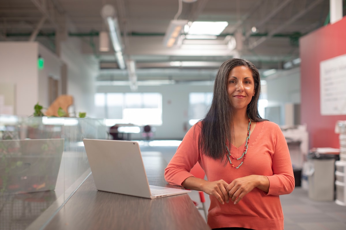 A confident medical practice manager at her desk, unbothered by a spam call claiming Google Business Profile is not free