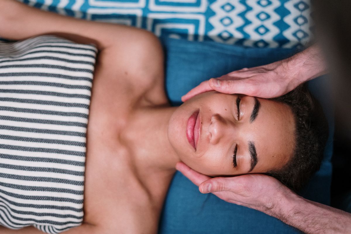 Client relaxing during a facial treatment at a med spa, the kind of service often sold on Groupon