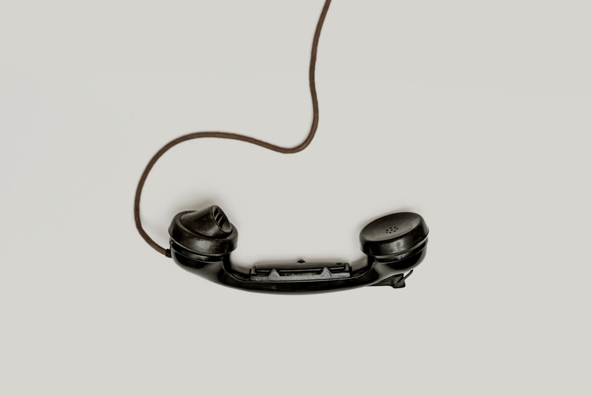 An office desk phone, the first thing a new patient meets when they call a medical practice with a long phone menu