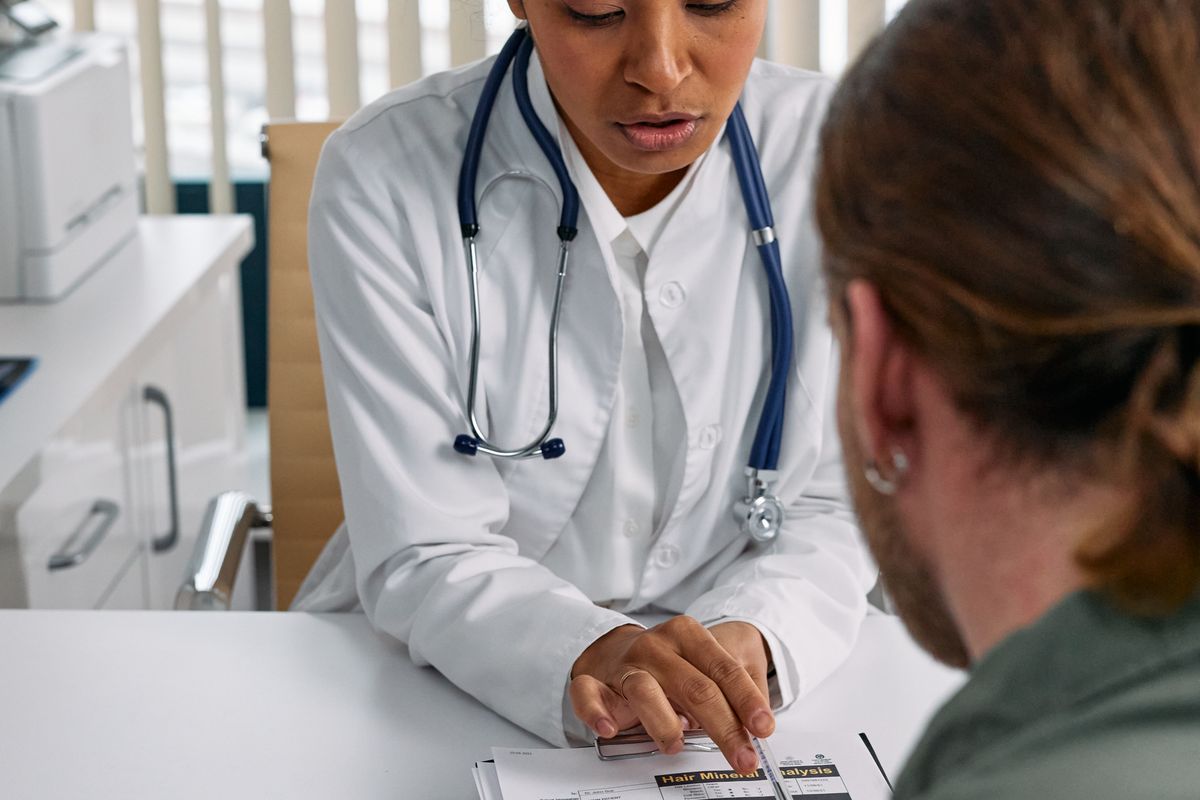 A doctor talking with a patient in their preferred language during a consultation