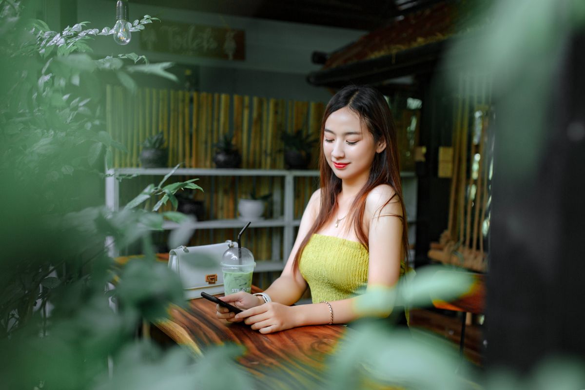 A future patient browsing on her phone, the moment a slow medical practice website can lose her