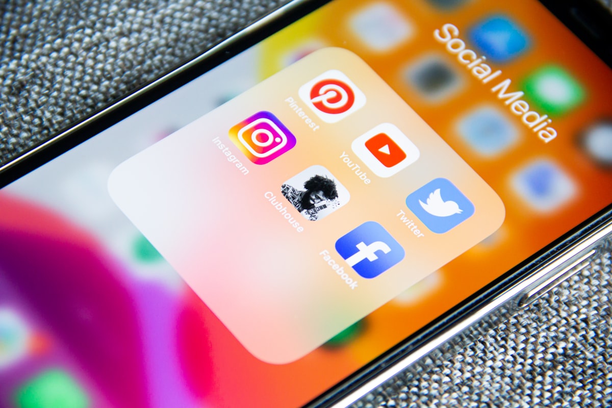 A phone showing Facebook, Instagram and other social apps, where medical practices choose between boosting a post and running a real ad