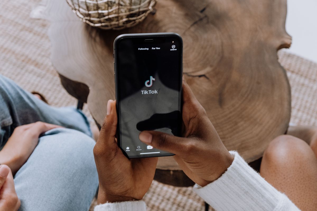 A young person on a smartphone, the audience a medical practice reaches when it advertises on Snapchat