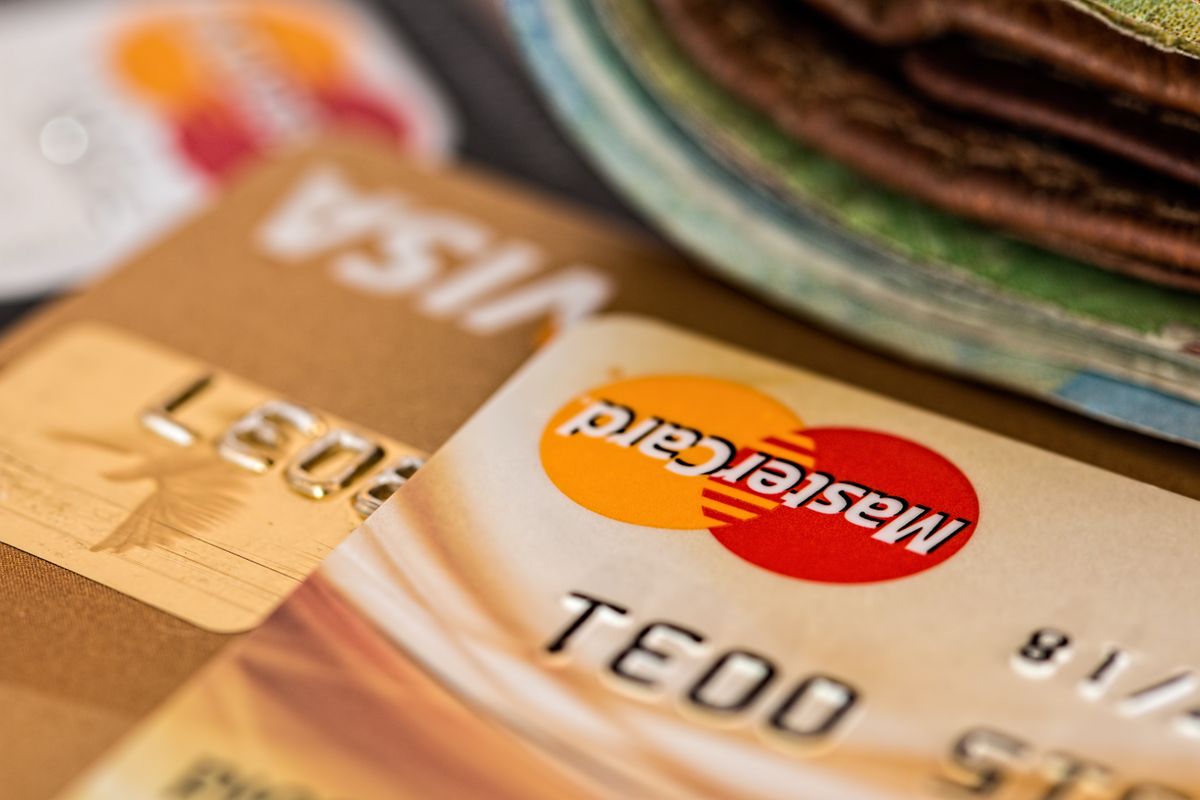 Credit cards on a table, standing in for a medical practice deciding whether to pay for Yelp Ads