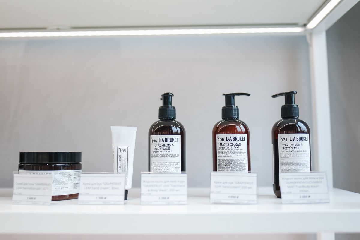 Professional skincare products lined up on a retail shelf, the kind of products a medical practice can sell online