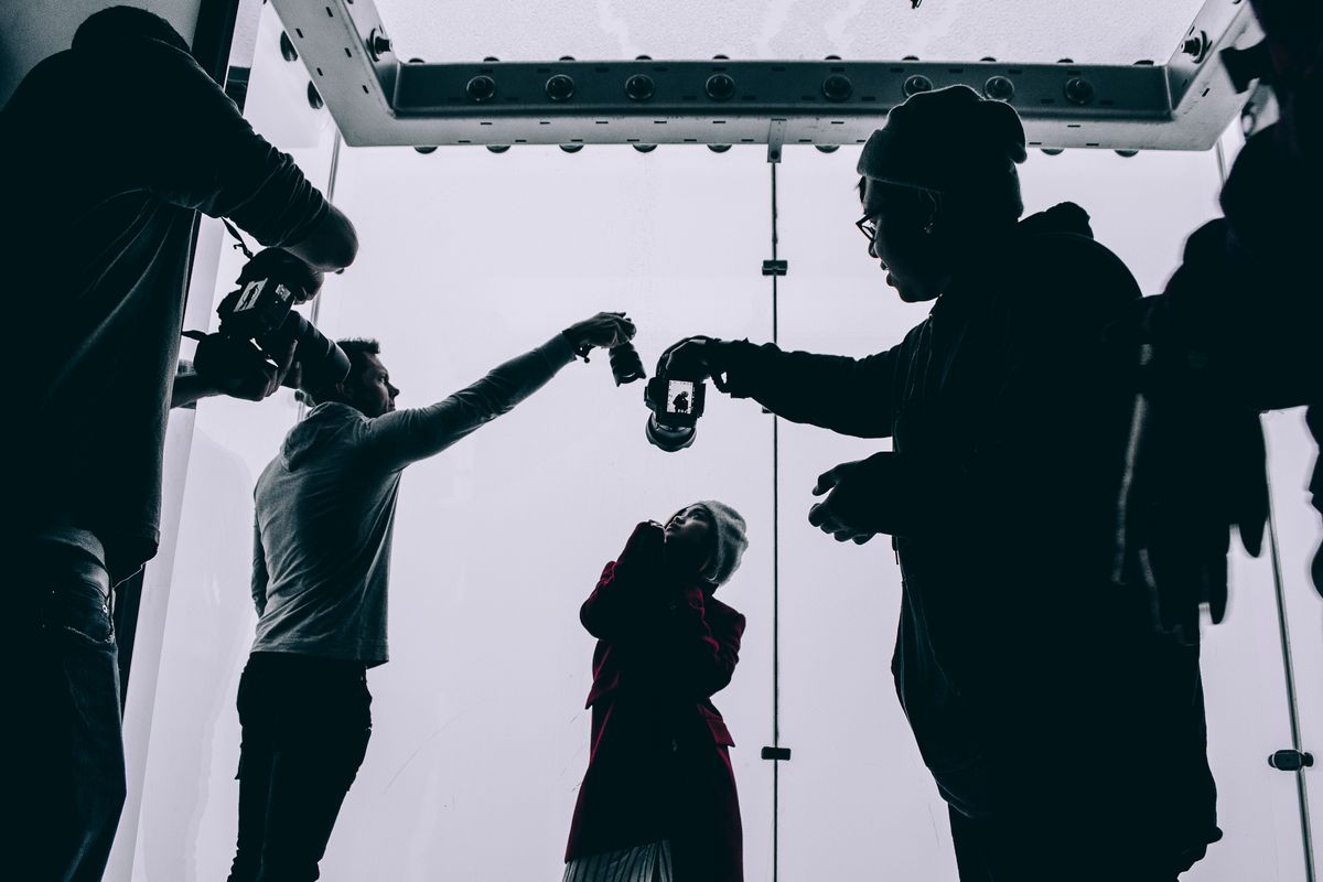 A real photographer shooting portraits in a studio, the authentic alternative to AI generated images for a medical practice