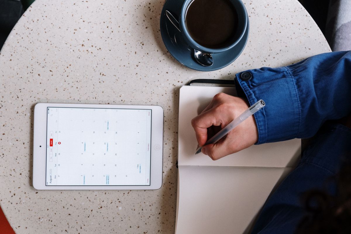 A patient rescheduling a medical appointment online from a tablet instead of calling the front desk