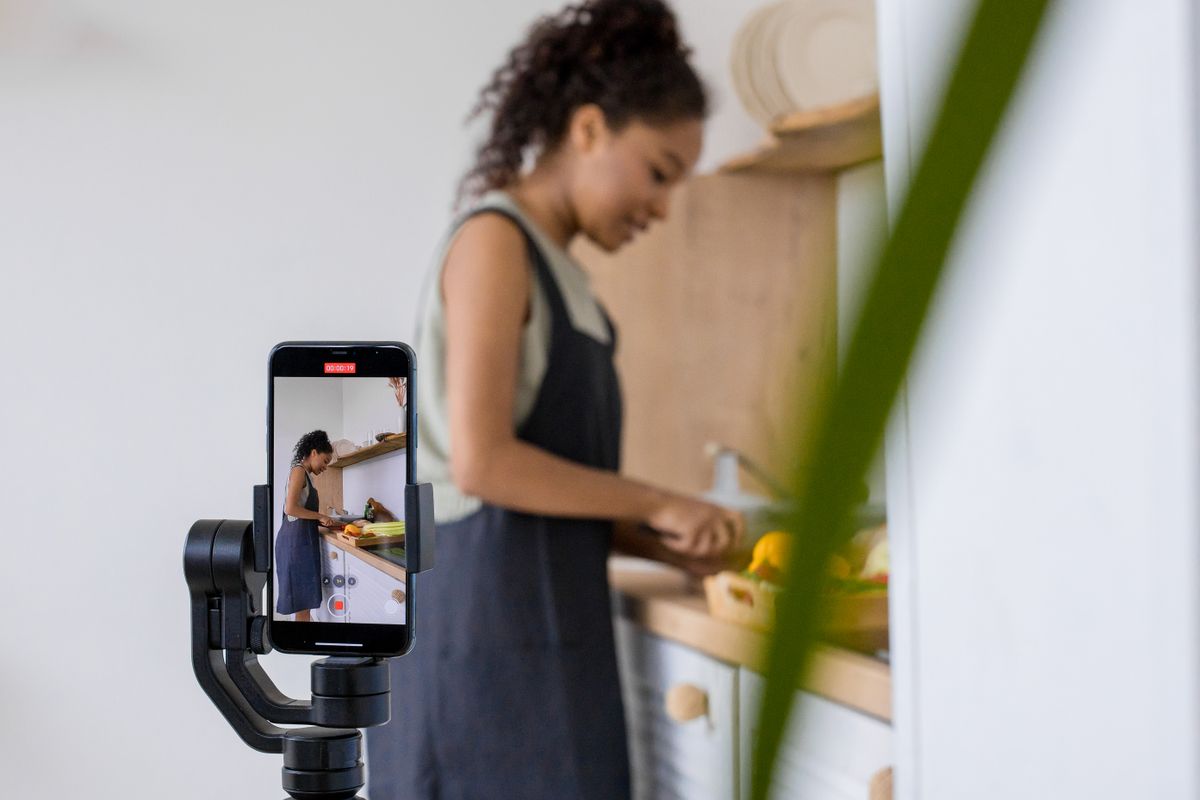 A smartphone on a gimbal filming a short video, showing how a medical practice can record video for its Google Business Profile