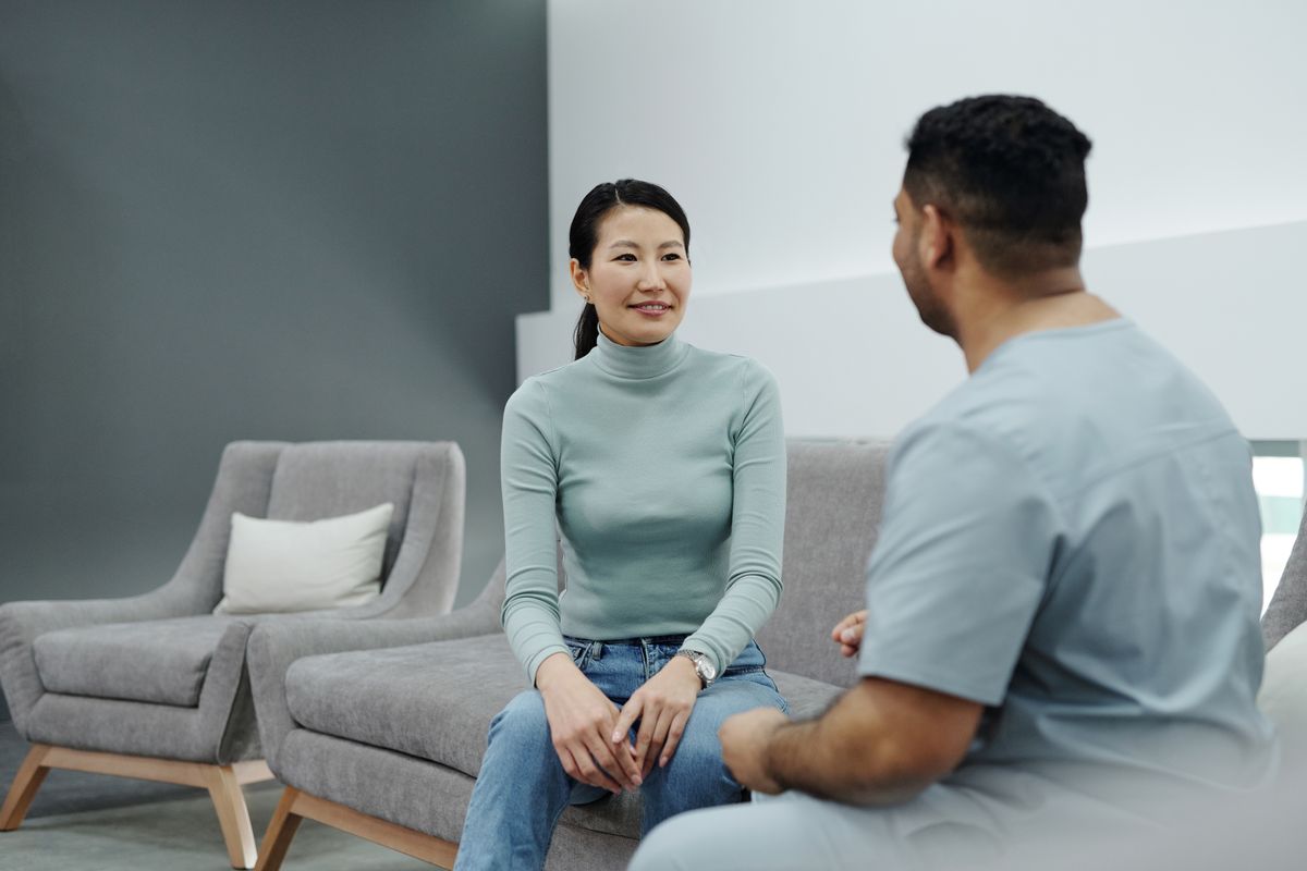 A new patient talking with a healthcare provider, the moment a practice might ask how did you hear about us