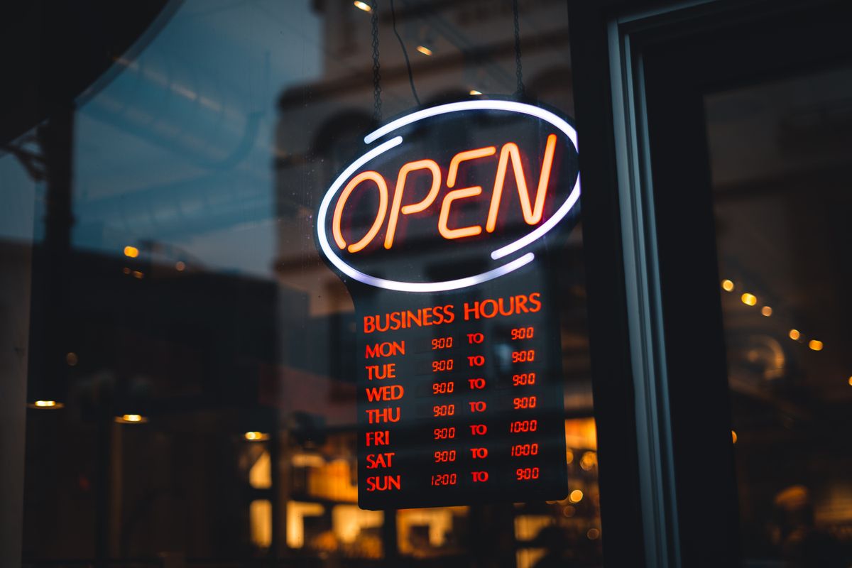 An opening hours sign in a store window, the kind of detail Google now wants to fill in for your medical practice automatically