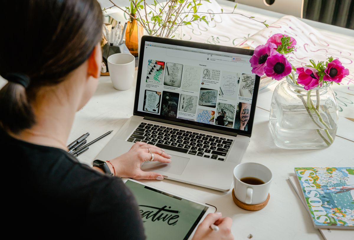 A practice owner reviewing their website on a laptop, deciding whether it is time for a redesign