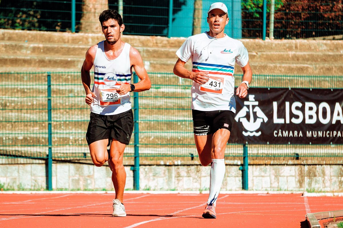 Two runners neck and neck on a track, a picture of a medical practice competing with a rival for the top spot on Google