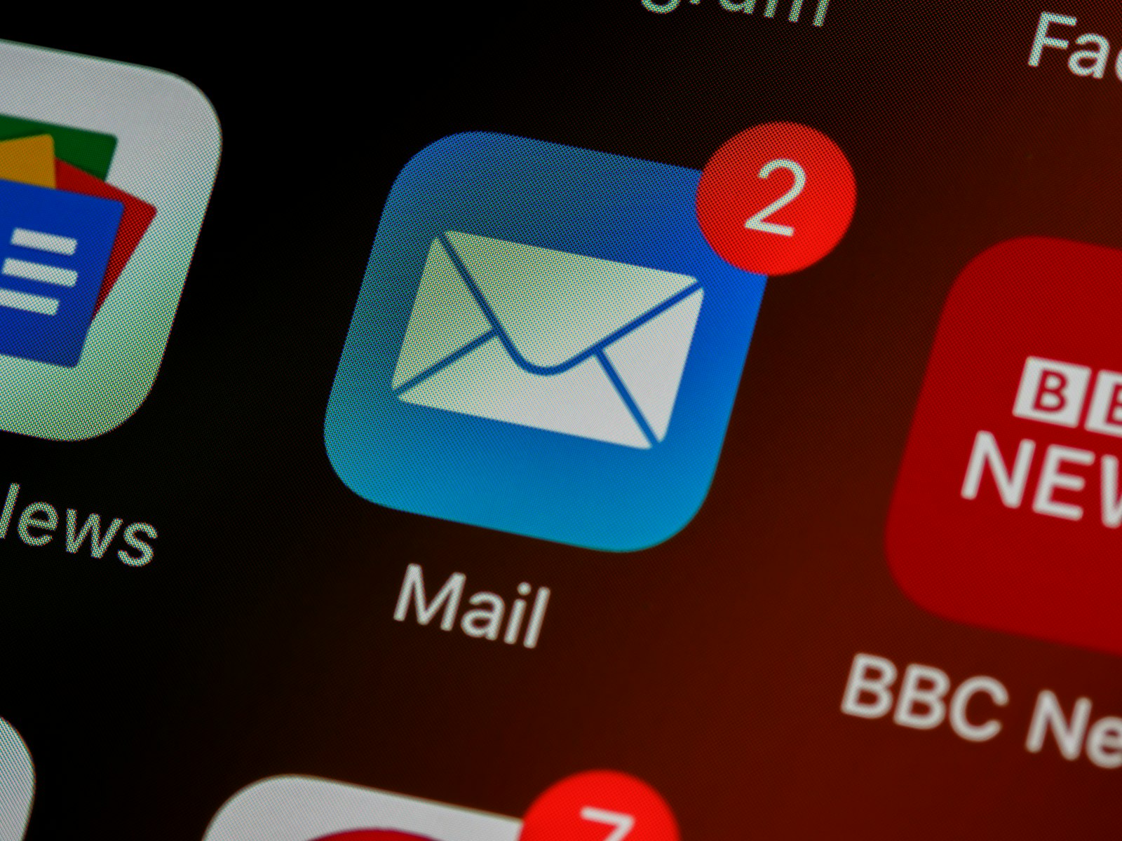 A phone showing email notifications, illustrating why medical practice emails can land in the spam folder