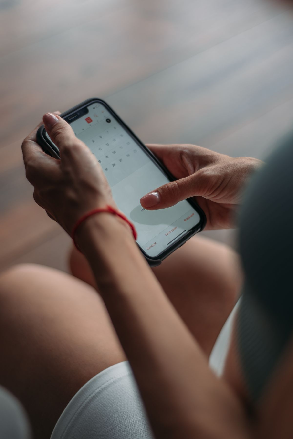 A patient using a smartphone to book a medical appointment online